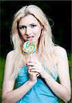 Girl And Her Lollipop On The Nature Background