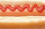 A hot dog with ketchup background. Shallow depth of field