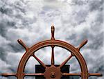 Illustration of a ships wheel steering a steady course through rough waters