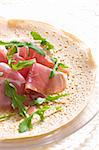 French pancake with Italian ham and ruccola