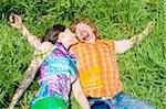 A couple sleeping in the meadow grass