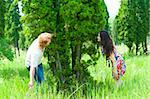 A couple playing hide and seek in park