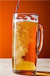 Big mug with beer isolated in motion