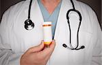 Male Doctor with Stethoscope and Blank Medicine Bottle.