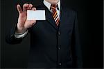 businessman holding blank card