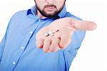 Man is offering medical pills on his palm