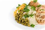 Healthy restaurant food: meatballs, potatoes, verdure, peas and corn on white. Close up.