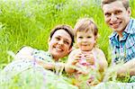 A family having rest in the meadow