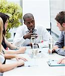 Happy businesspeople drinking champagne in office