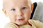 Bright closeup portrait of adorable baby boy and his mom