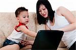 Young mother with her son using a laptop