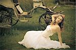 beautiful bride and an old  carriage / retro style toned