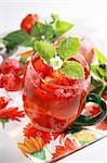 Refreshing summer ice tea with fruits and herbs