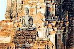 Buddha statues at the ruins of the Buddhist temple of Wat Chai Wattanaram in Ayutthaya near Bangkok, Thailand.