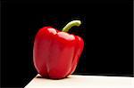 isolated red pepper on black background