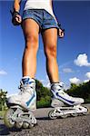 Inline skates. closeup of woman legs and skates.