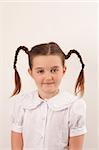 School girl wearing uniform with funny hair style