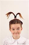 School girl wearing uniform with funny hair style