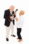 Senior man plays mandolin while his wife signs along.  Full body isolated.