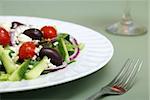 A delicious greek salad on a table.