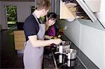 Couple cooking together in a modern kitchenkitchen