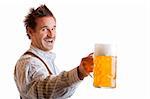 Bavarian Man dressed with traditional leather trousers (lederhose) holding Oktoberfest Beer Stein (Mass)