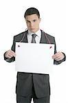 Young handsome businessman with white copy space isolated at studio