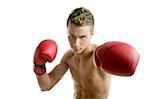 Young  shaped man boxing, isolated studio shot
