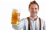 Bavarian man dressed with leather trousers is holding an Oktoberfest Beer Stein into camera. Isolated on white background.