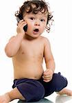 Baby with telephone, isolated on a white background.