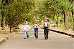 Three young friends go for a walk the park