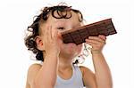 Child eats chocolate,isolated on a white background.