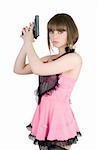 Pretty girl in a pink dress with pistol