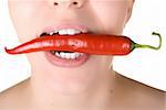 girl close up with chili pepper at her lips isolated on white