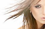 Close up - a half of face of beauty with flying hair, isolated