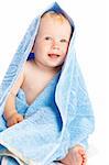 Baby sitting covered with a blue towel