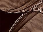 sepia toned jacket fragment with metal zipper