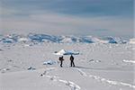 People on snow-shoes with Sermilik Fjord's ice field in background