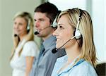 Businesspeople working with headsets in an office