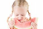 Shot of little girl eating watermelon isolated on white