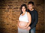 Young couple waiting for a baby. Eighth month pregnancy.