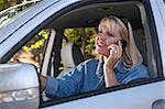 Attractive Blonde Woman Using Cell Phone While Driving