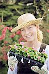 Woman with container-grown plants