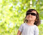 child in sunglasses outdoors