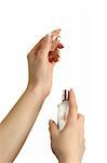 Woman applying perfume on her right wrist, from  luxury bottle.  Isolated on white.