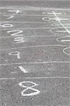 game of hopscotch drawn with chalk on asphalt