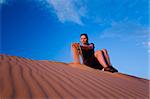 Woman admiring Coral Pink Sand Dunes State Park in Utah