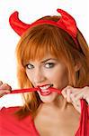 close up of a red haired girl with horns like a devil biting a red tail