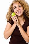 A pretty young woman holding a green apple