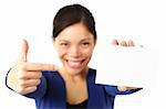 Pointing at blank paper card. very happy excited woman pointing at empty white paper.